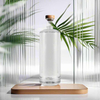 Custom Logo Printed Frost Surface Glass Bottle with Thick Base Round Shape and Pump Sprayer Seal for Packaging